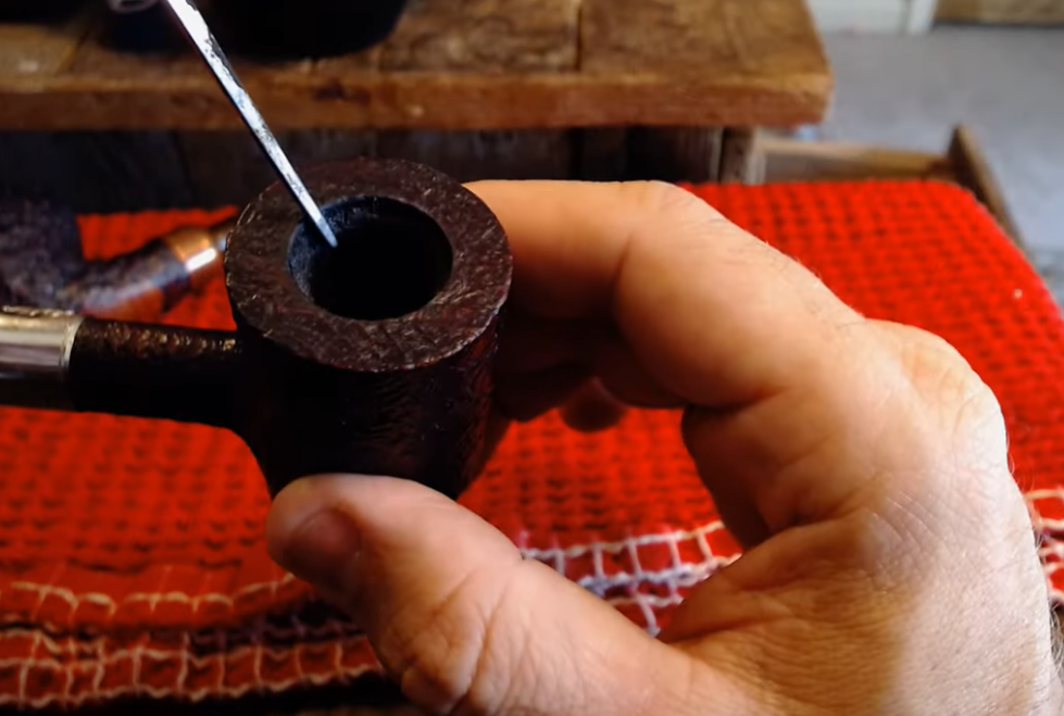 What is the purpose of the "char" layer that develops when breaking in a pipe?